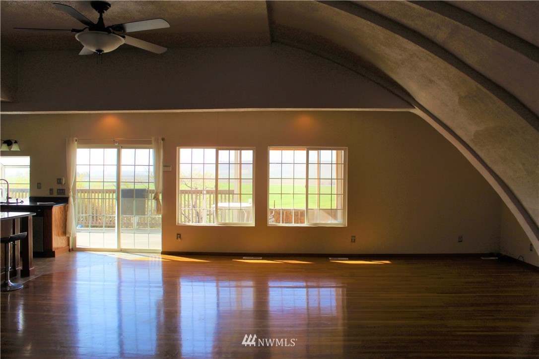1017 South Sundance Road Othello, WA 99344 - Photo 16 of 34 a view of an empty room with wooden floor and a window