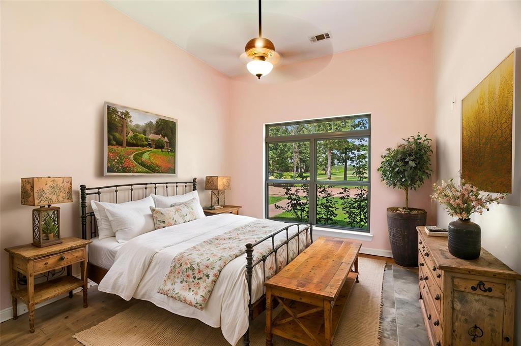 821 County Road Paris, TX 75462 - Photo 11 of 40 Spacious room featuring a vaulted ceiling and a ceiling fan with integrated lighting