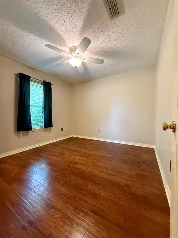 11535 Timber Ridge Drive Keithville, LA 71047 - Photo 18 of 39 wooden floor in an empty room