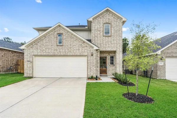 a living room with stainless steel appliances kitchen island granite countertop furniture wooden floor and a kitchen view