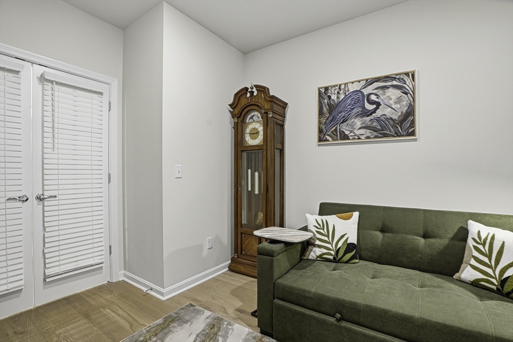 2 Codman Way, Unit 2203 Westborough, MA 01581 - Photo 19 of 36 a living room with a couch and a window