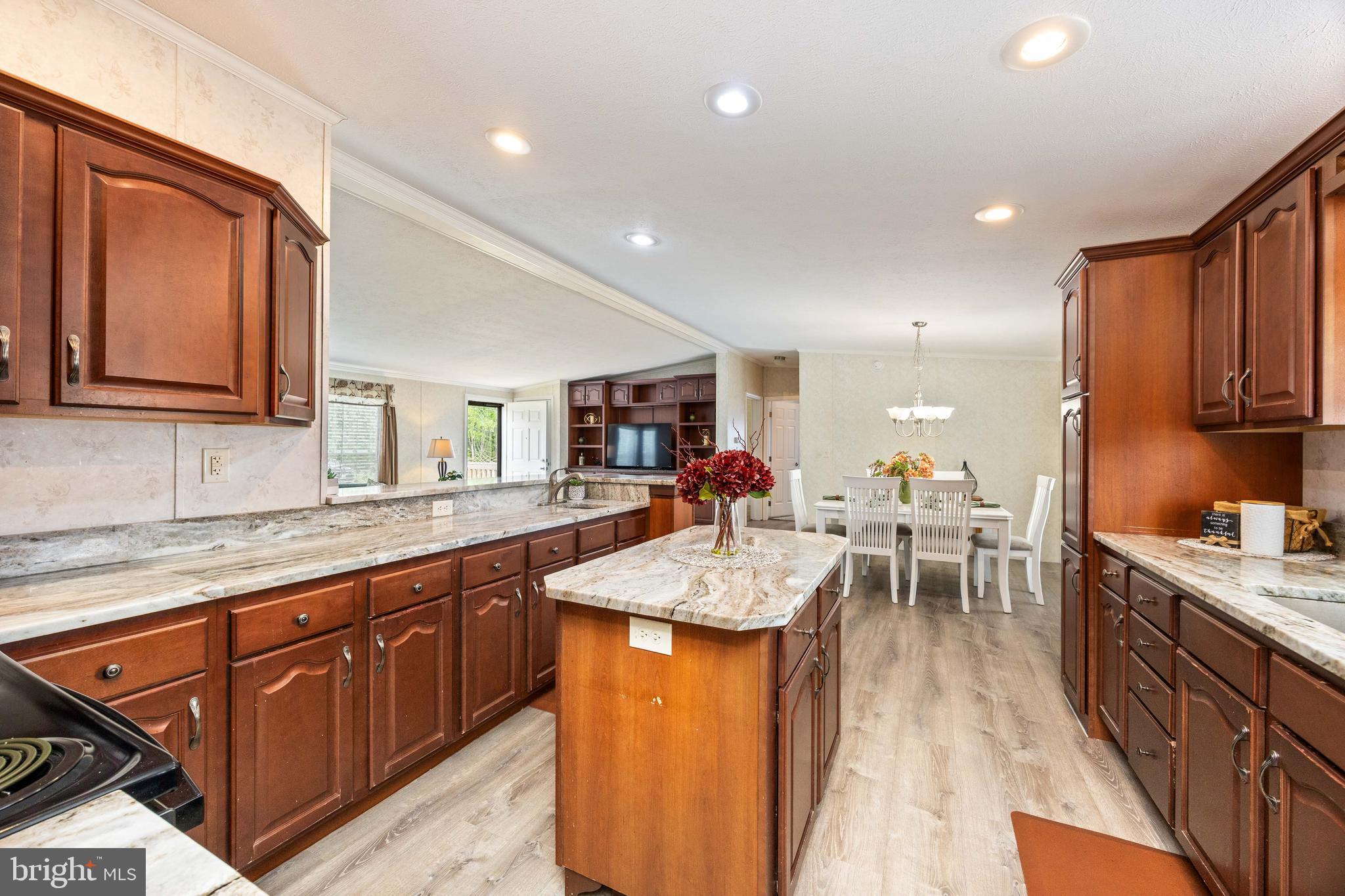 4258 Smith Road Salisbury, MD 21801 - Photo 23 of 43 a view of a kitchen counter top space a sink stainless steel appliances and cabinets