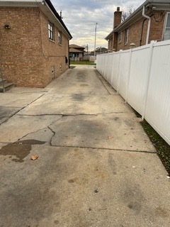 7733 Rutherford Avenue Burbank, IL 60459 - Photo 12 of 13 a view of a house with a wooden fence