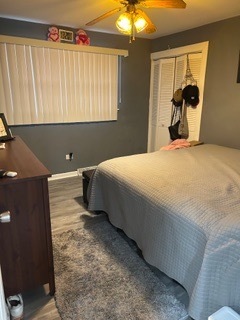 7733 Rutherford Avenue Burbank, IL 60459 - Photo 5 of 13 a bedroom with a bed and a painting on the wall