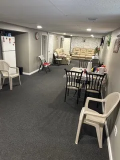 a view of a livingroom with furniture and a table