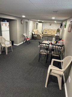 7733 Rutherford Avenue Burbank, IL 60459 - Photo 9 of 13 a view of a livingroom with furniture and a table
