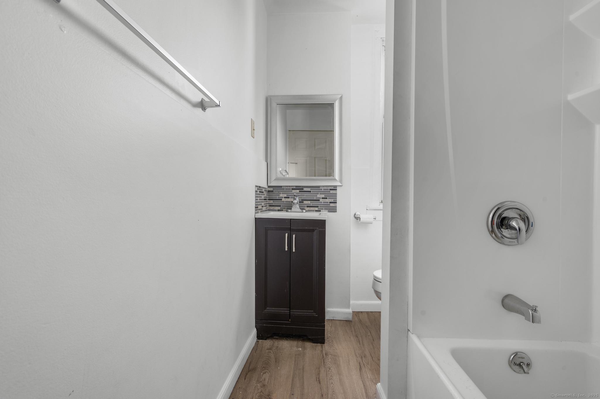 387 Nichols Street, Unit 2 Bridgeport, CT 06608 - Photo 19 of 28 a bathroom with a bathtub and a shower