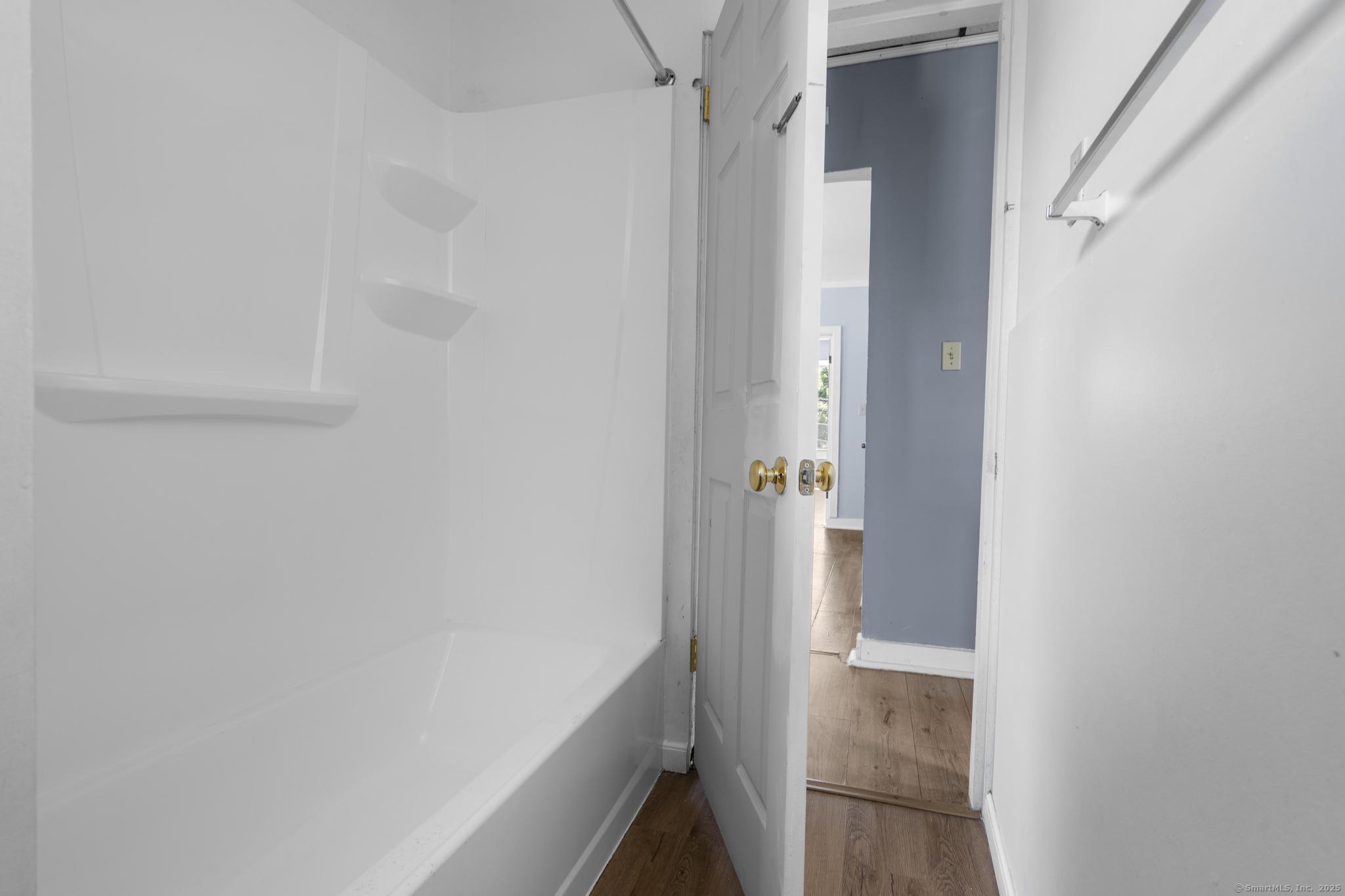 387 Nichols Street, Unit 2 Bridgeport, CT 06608 - Photo 20 of 28 a bathroom with a bathtub