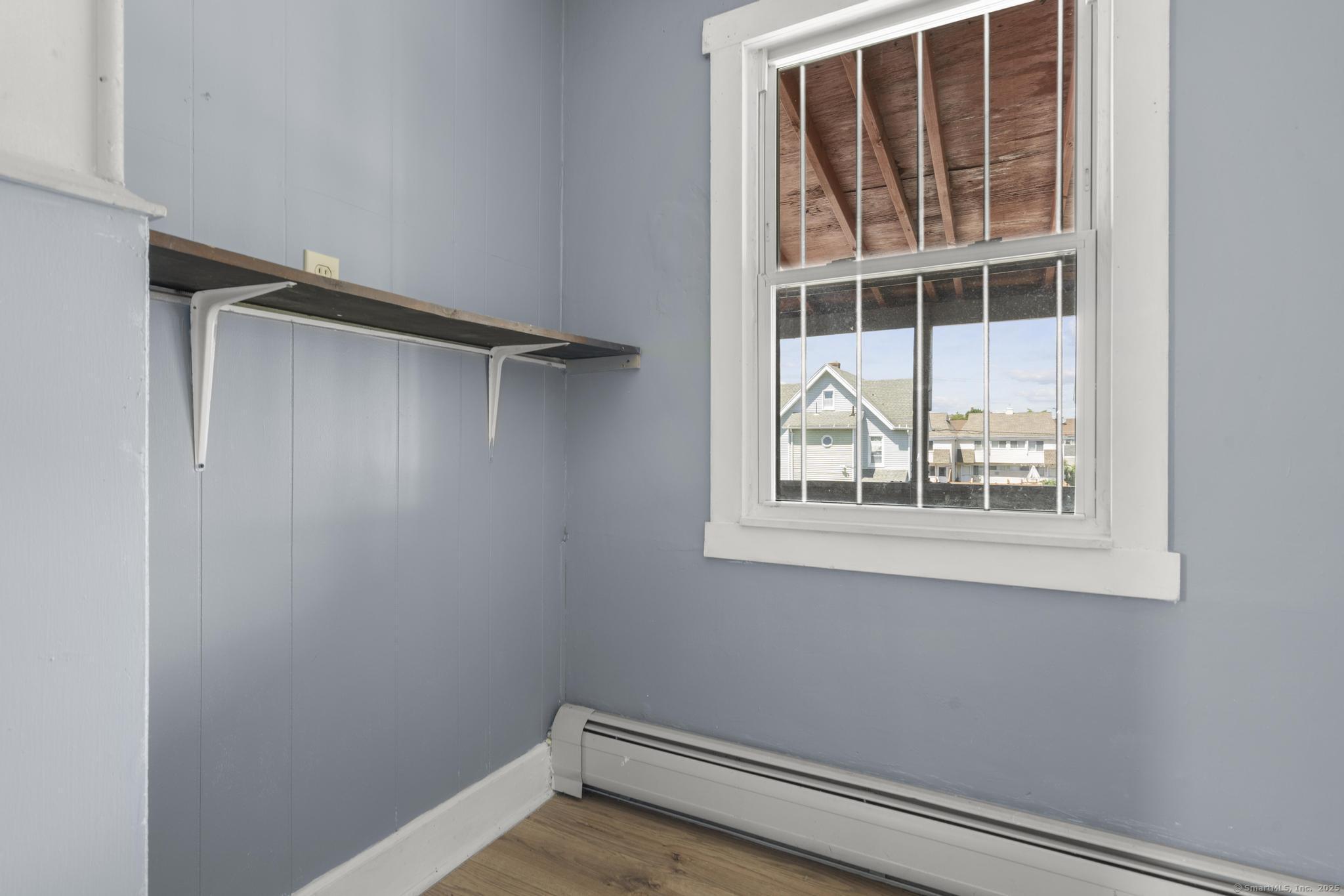 387 Nichols Street, Unit 2 Bridgeport, CT 06608 - Photo 26 of 28 a view of an empty room with a window