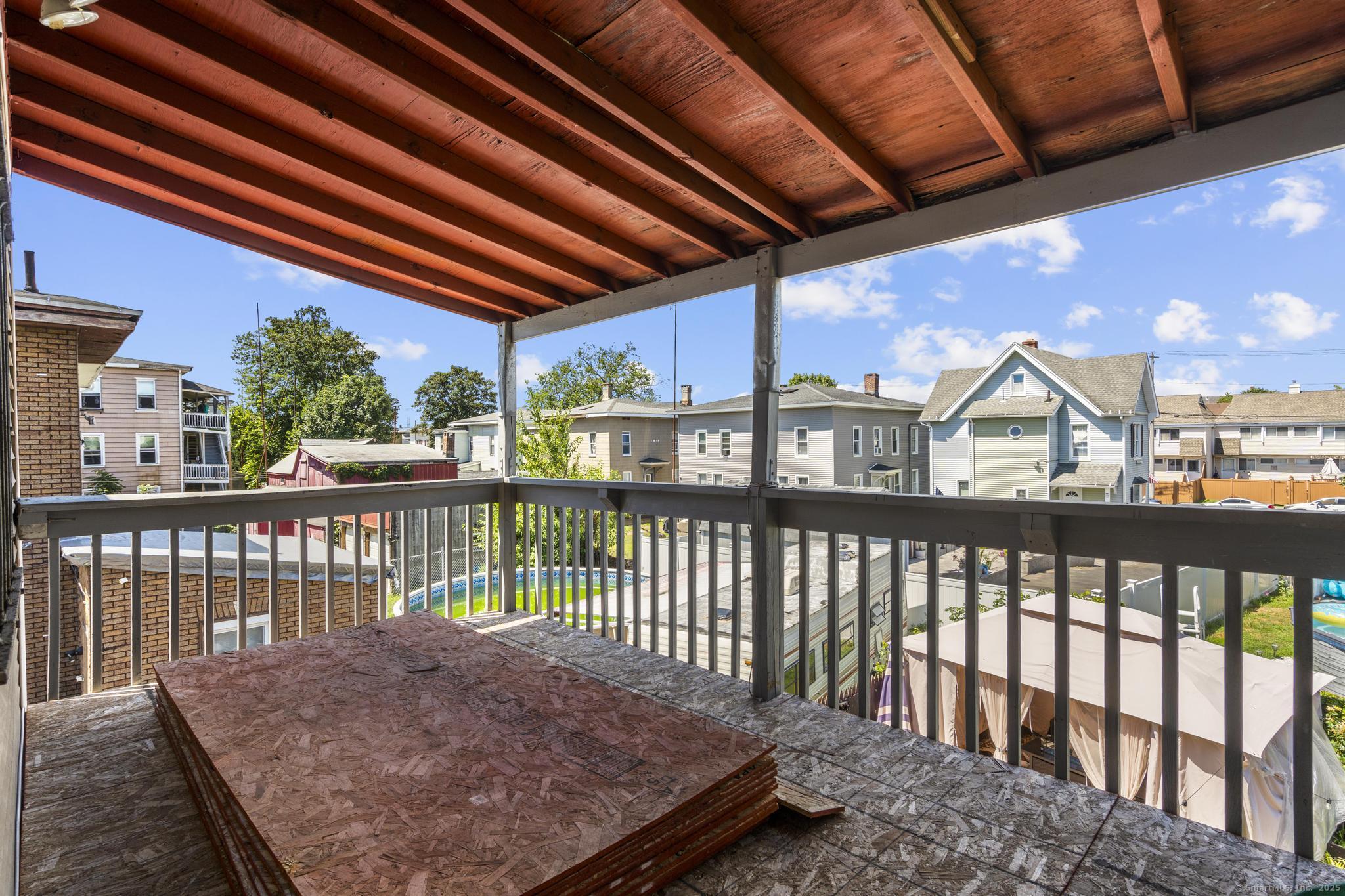 387 Nichols Street, Unit 2 Bridgeport, CT 06608 - Photo 28 of 28 a view of a balcony with a wooden floor