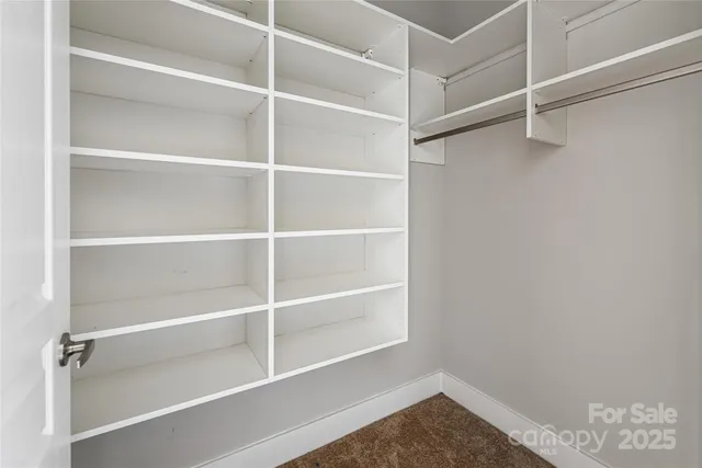 a view of a hallway with washer and dryer