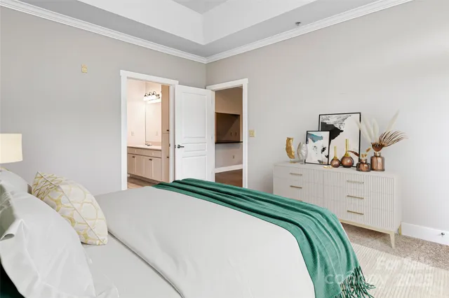 a bedroom with a bed and cabinet