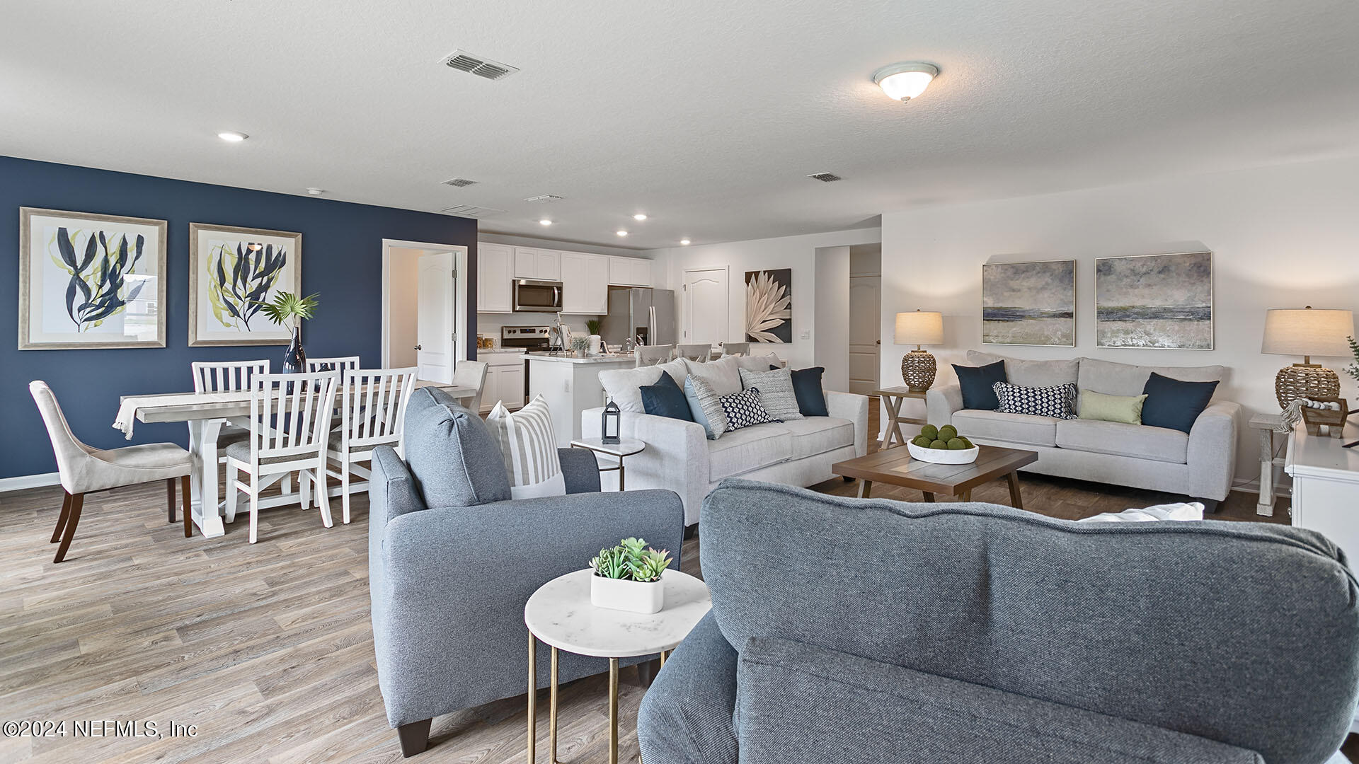 123 Hulett Wds Road Palm Coast, FL 32137 - Photo 11 of 33 a living room with furniture kitchen view and a wooden floor