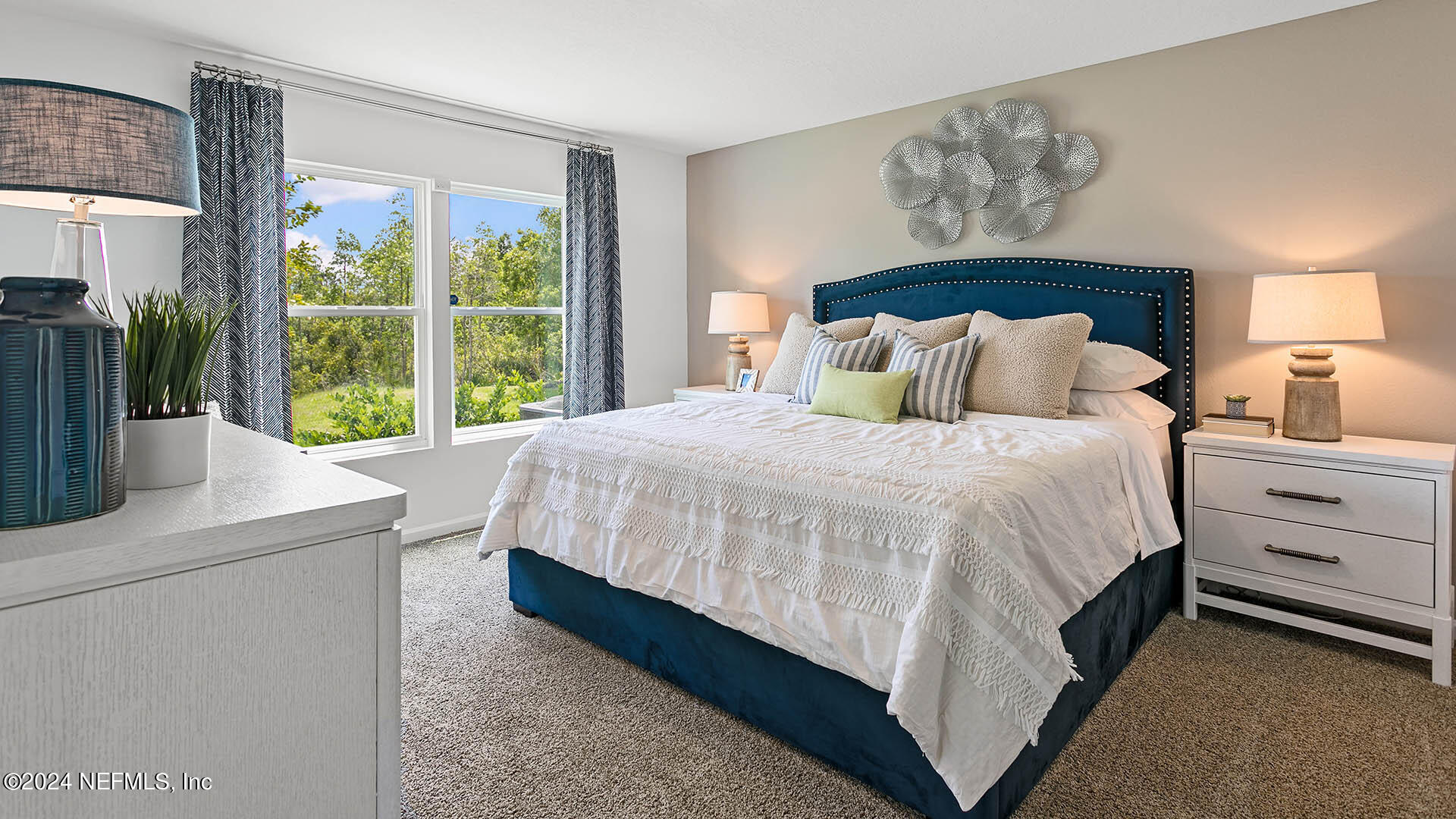 123 Hulett Wds Road Palm Coast, FL 32137 - Photo 12 of 33 a large bed sitting in a bedroom next to a window