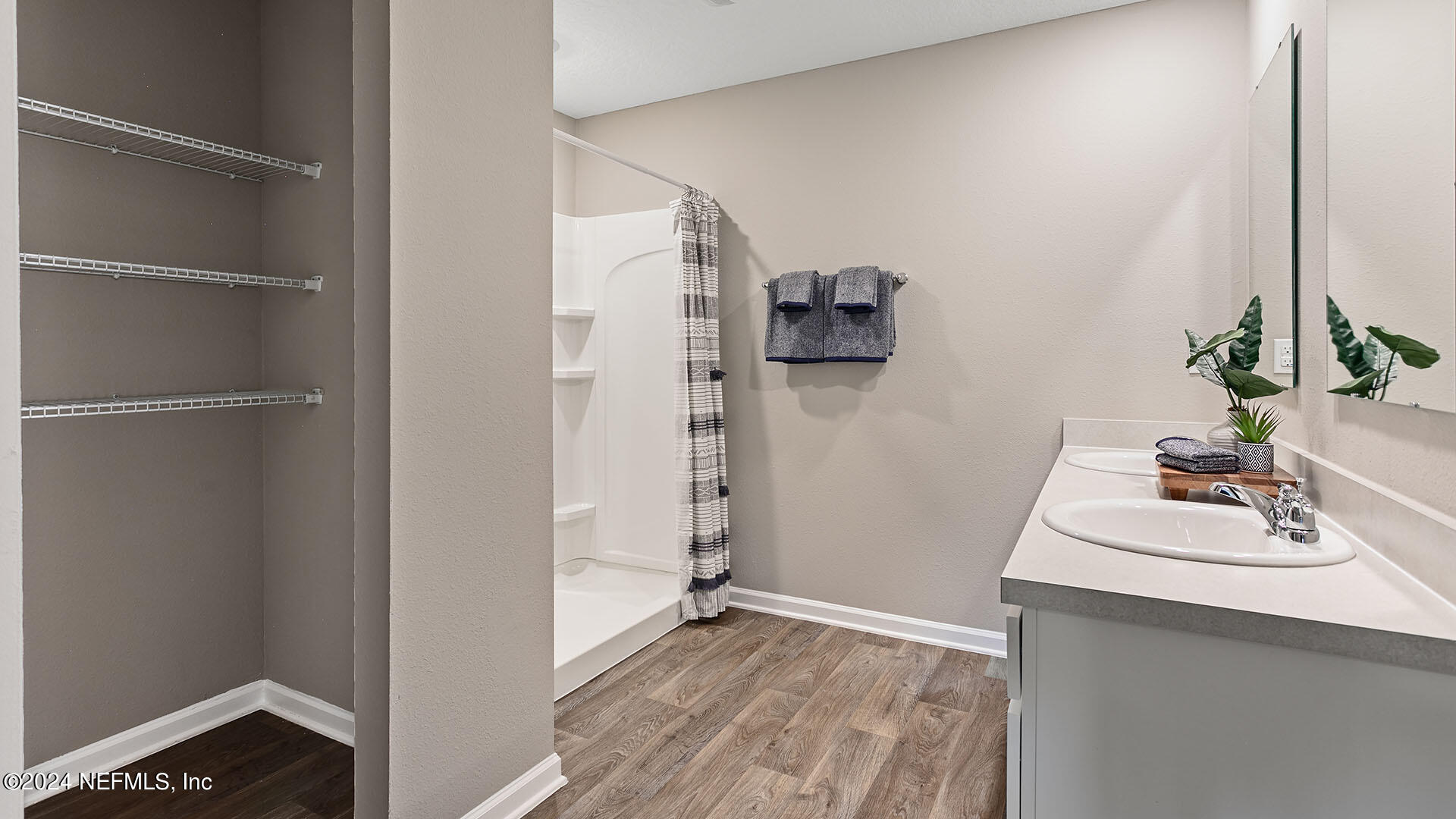 123 Hulett Wds Road Palm Coast, FL 32137 - Photo 13 of 33 a bathroom with a sink and mirror