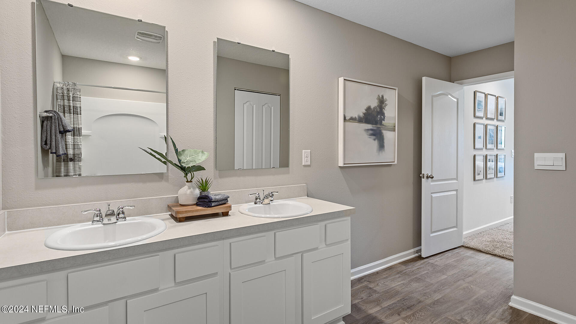 123 Hulett Wds Road Palm Coast, FL 32137 - Photo 14 of 33 a bathroom with a sink and a mirror