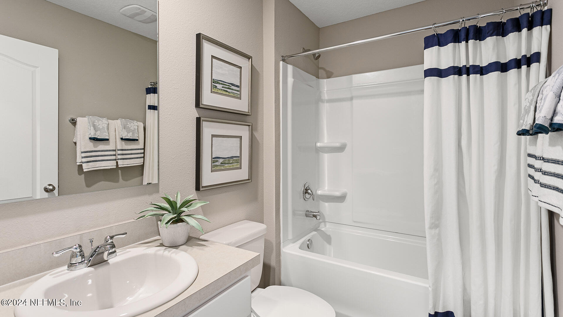 123 Hulett Wds Road Palm Coast, FL 32137 - Photo 18 of 33 a bathroom with a sink toilet and shower