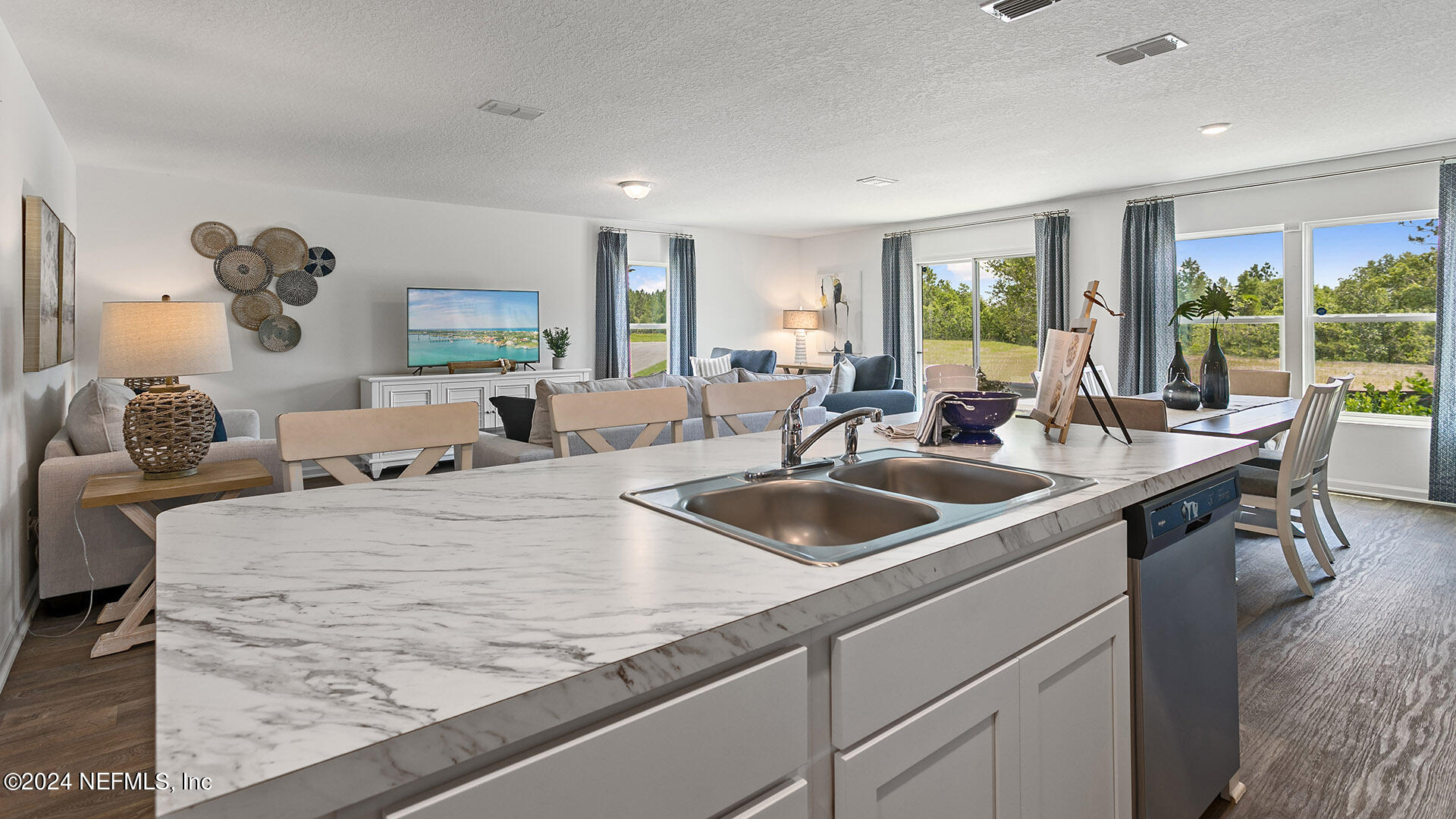 123 Hulett Wds Road Palm Coast, FL 32137 - Photo 6 of 33 a view of kitchen island a sink and living room