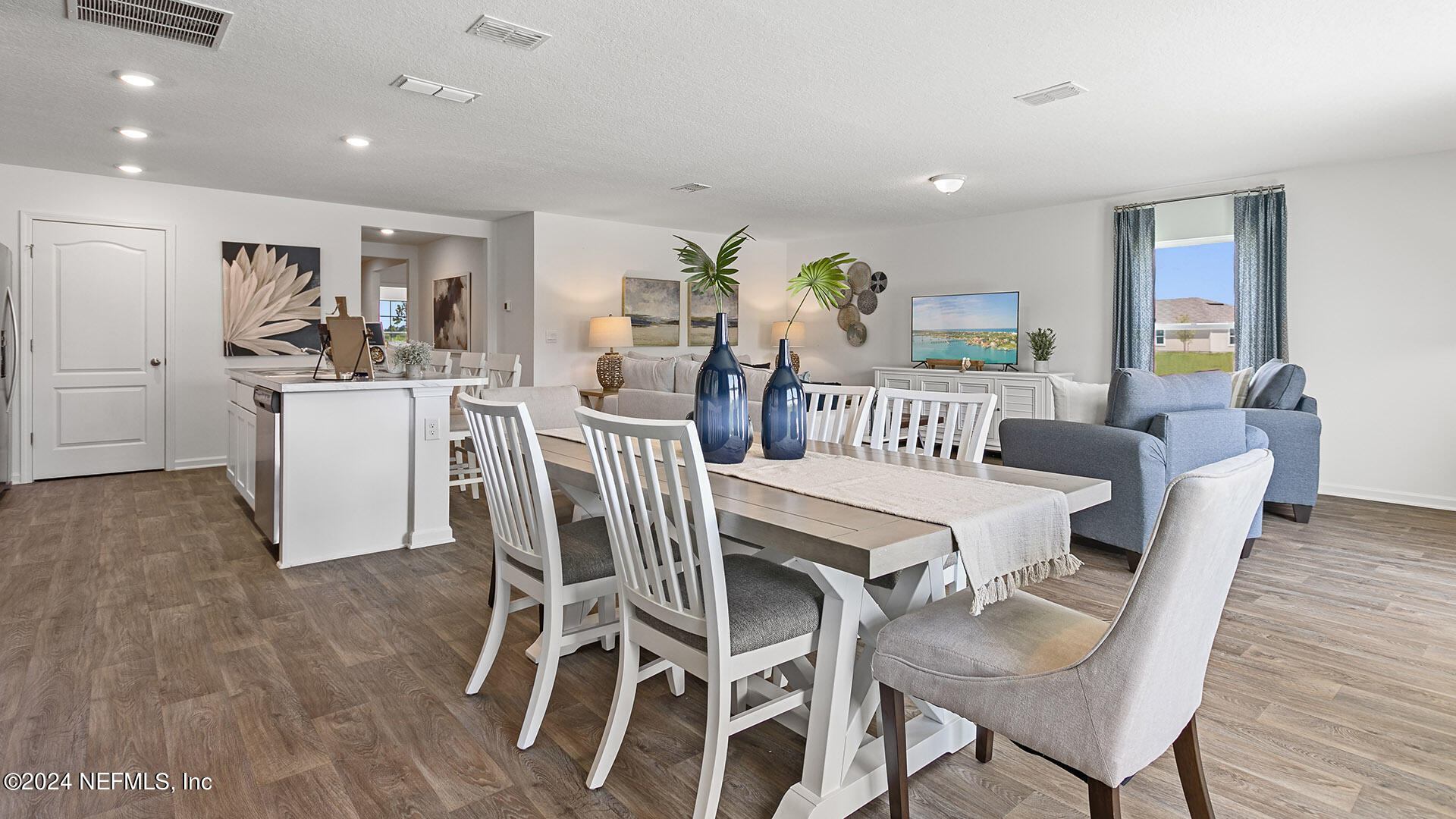 123 Hulett Wds Road Palm Coast, FL 32137 - Photo 8 of 33 a dining room with furniture and wooden floor