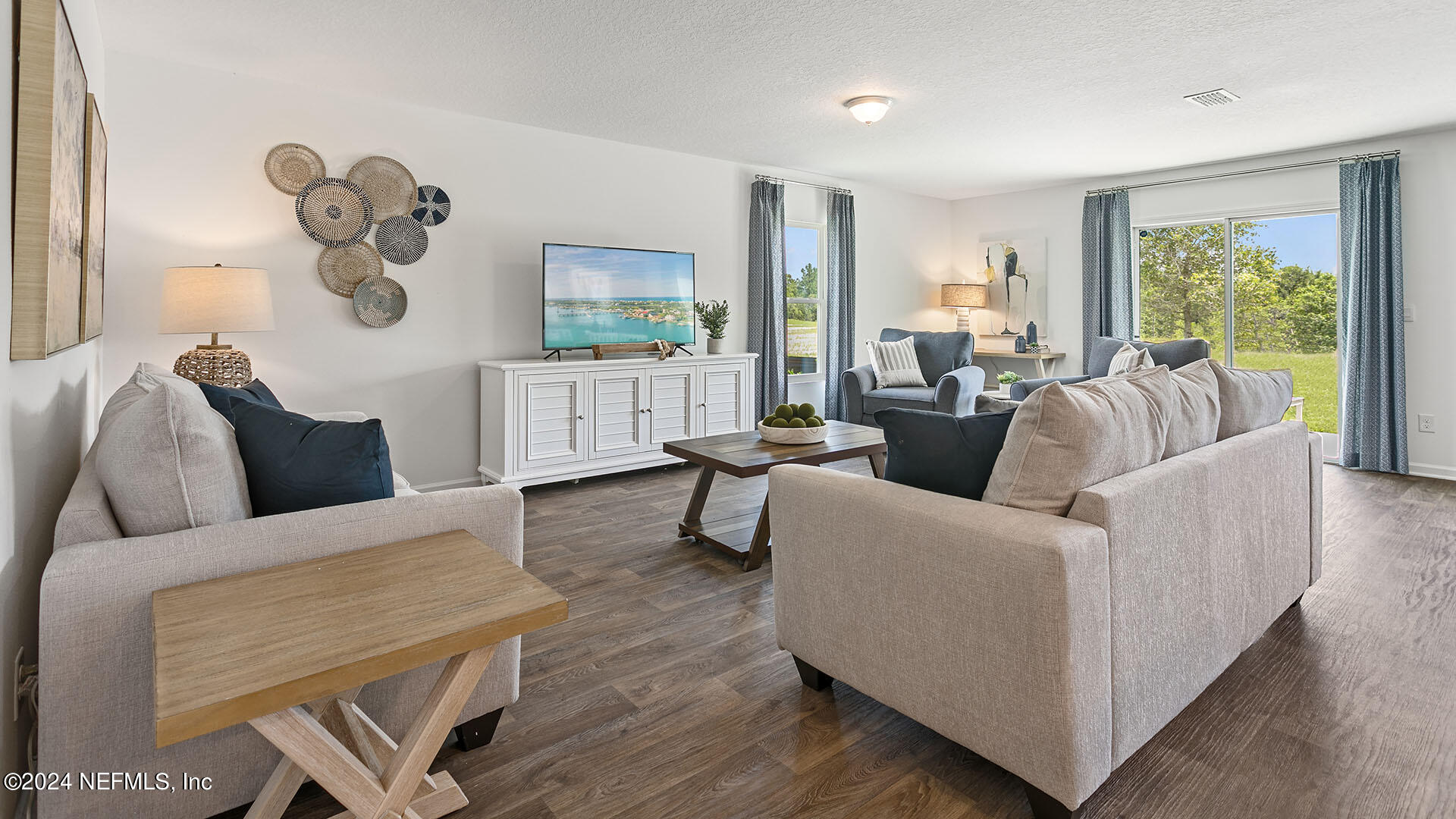 123 Hulett Wds Road Palm Coast, FL 32137 - Photo 9 of 33 a living room with furniture and a large window