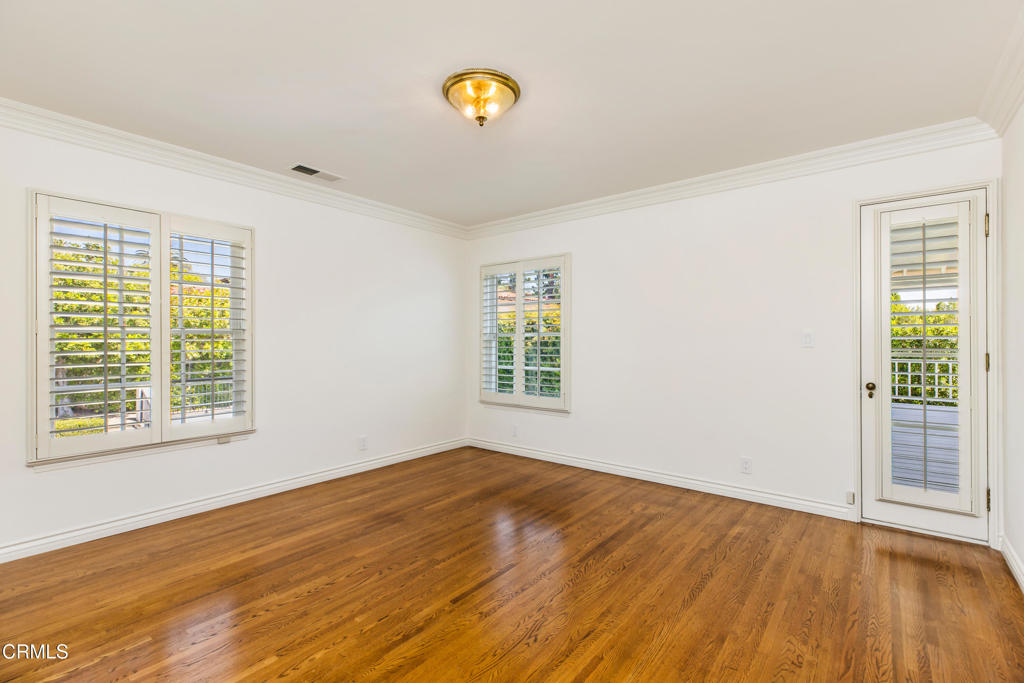 1184 Arden Road Pasadena, CA 91106 - Photo 40 of 62 a view of empty room with wooden floor and fan