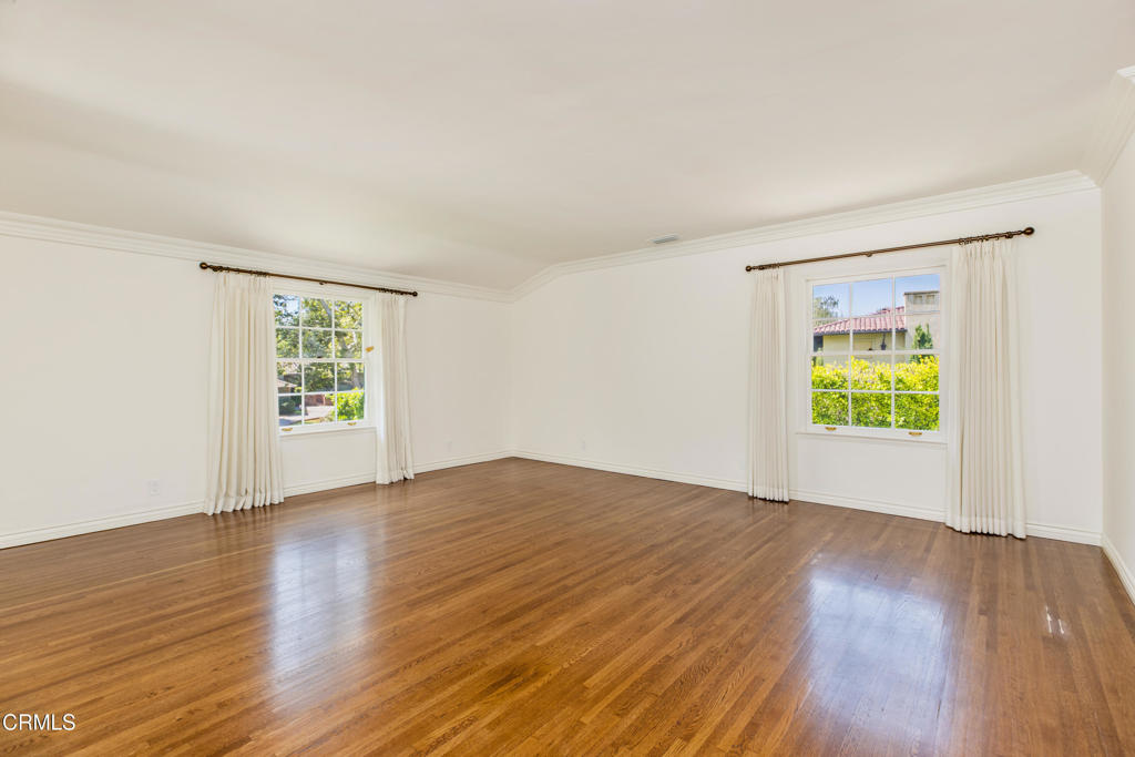 1184 Arden Road Pasadena, CA 91106 - Photo 58 of 62 a view of an empty room with wooden floor and a window