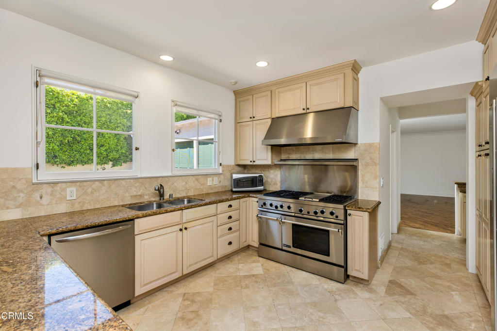 1184 Arden Road Pasadena, CA 91106 - Photo 8 of 62 a kitchen with stainless steel appliances a stove a sink and a microwave