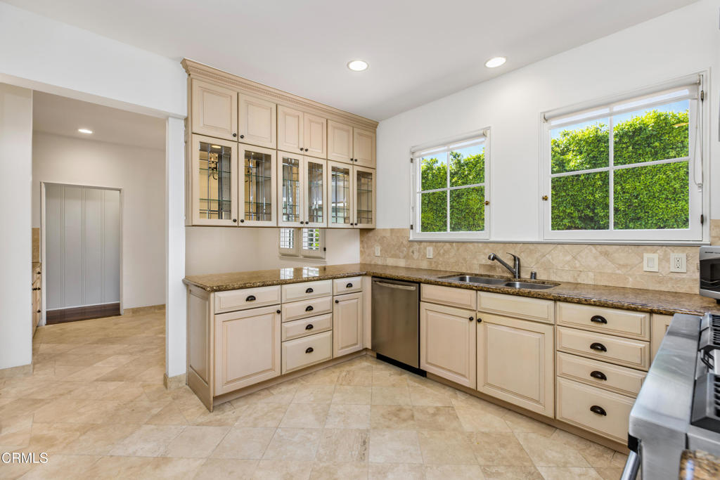 1184 Arden Road Pasadena, CA 91106 - Photo 10 of 62 a kitchen that has a sink and a stove in it