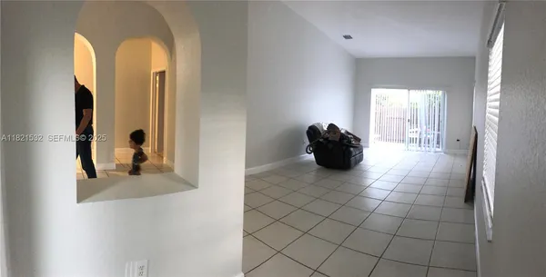 a bed room with a bed and a chair