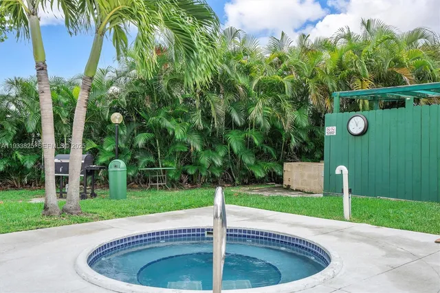 a view of a backyard with a fountain