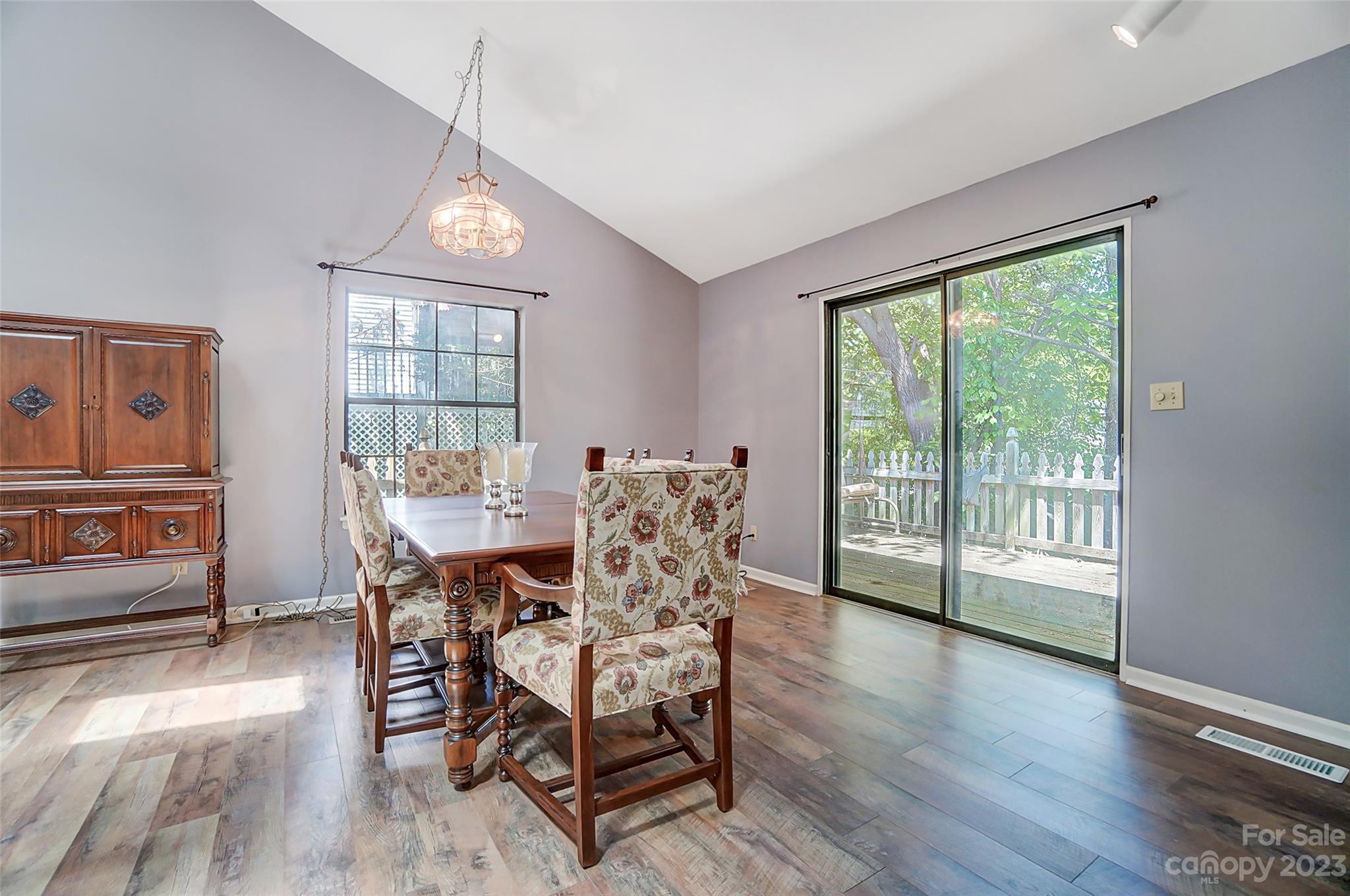 1205 Molokai Drive Tega Cay, SC 29708 - Photo 16 of 32 a view of a dining room with furniture window and wooden floor