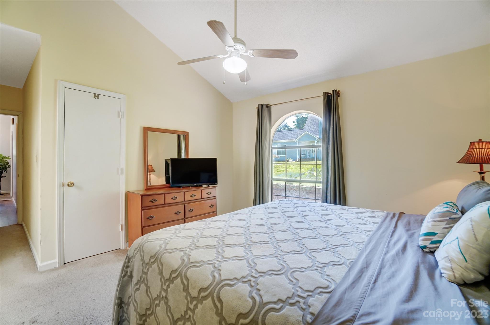 1205 Molokai Drive Tega Cay, SC 29708 - Photo 19 of 32 a bedroom with a bed and a flat screen tv