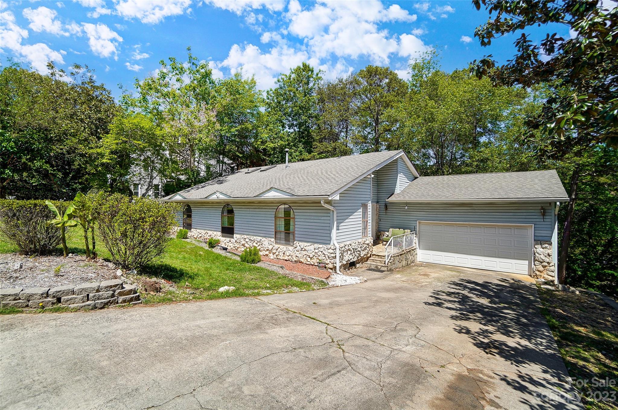 1205 Molokai Drive Tega Cay, SC 29708 - Photo 2 of 32 front view of a house with a bench