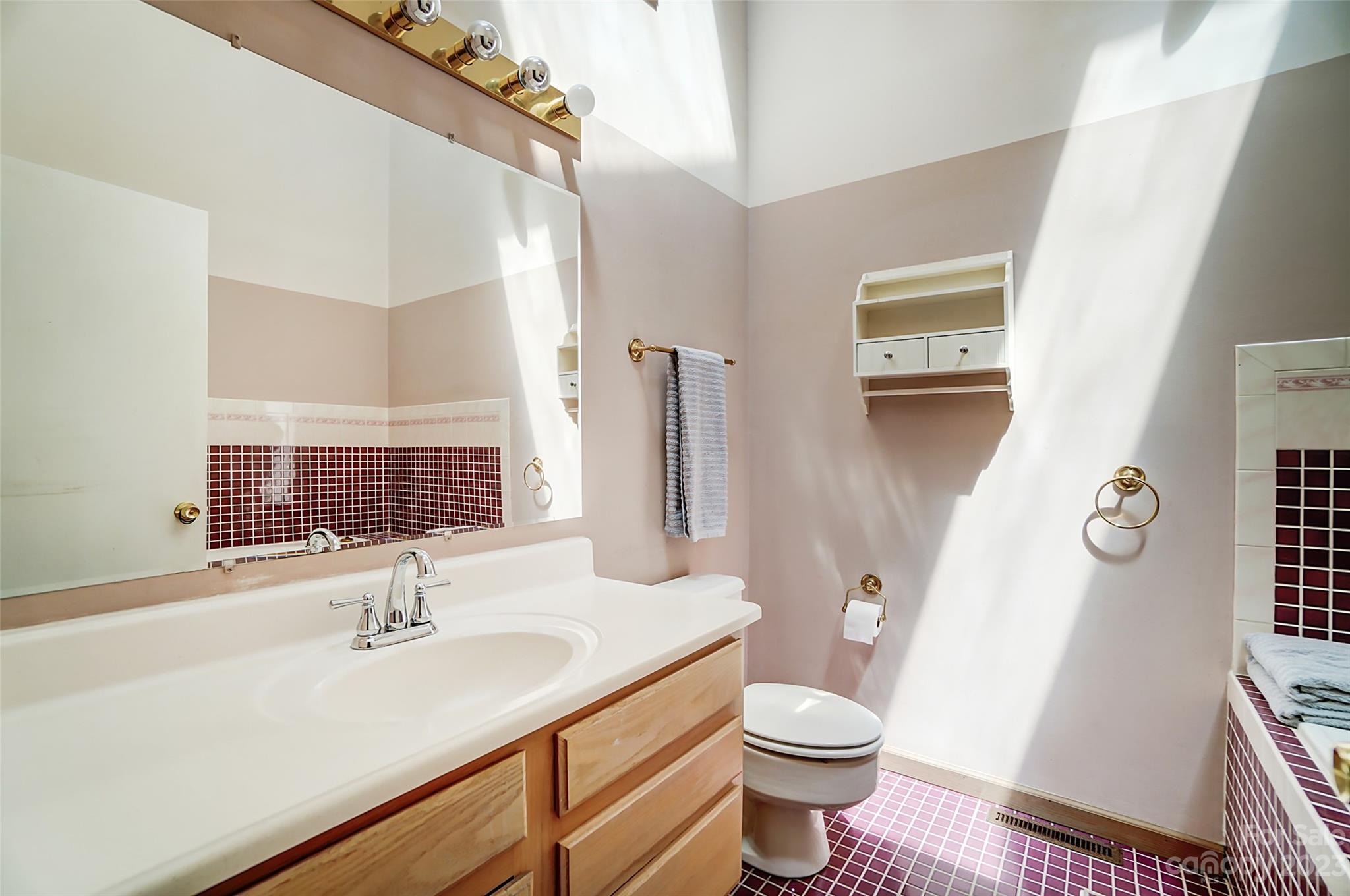 1205 Molokai Drive Tega Cay, SC 29708 - Photo 22 of 32 a bathroom with a sink toilet and shower