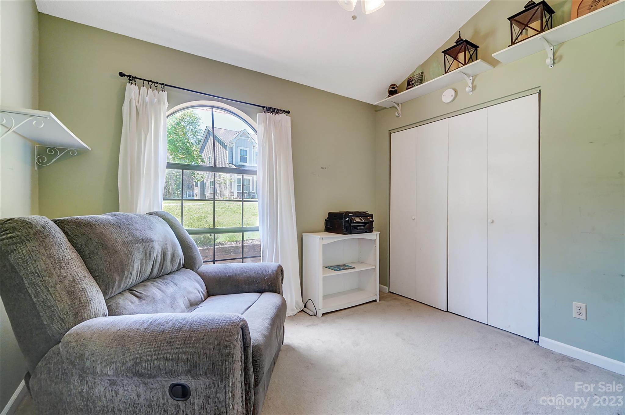 1205 Molokai Drive Tega Cay, SC 29708 - Photo 24 of 32 a living room with furniture and a window