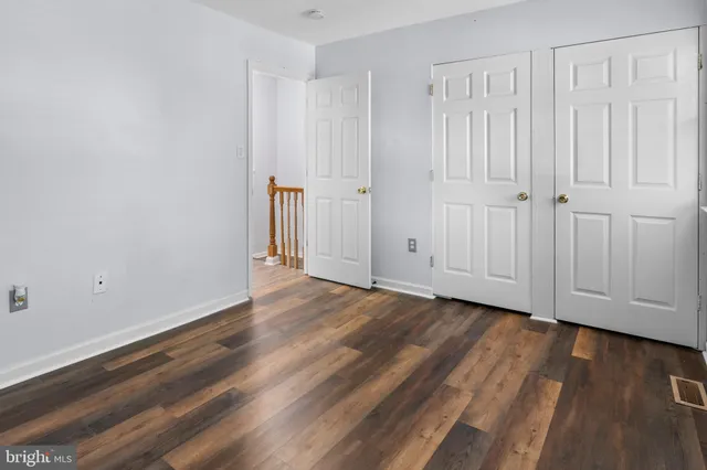 a view of a livingroom with wooden floor