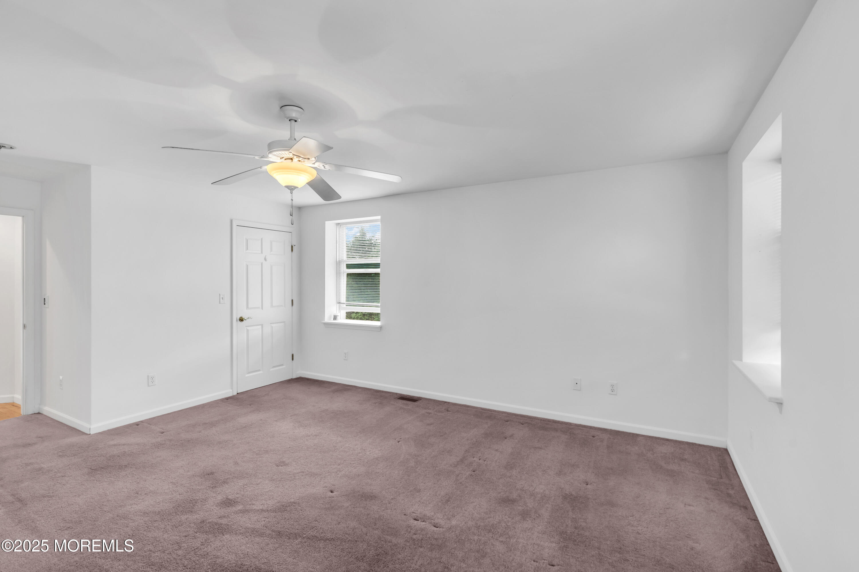 101 Main Street Farmingdale, NJ 07727 - Photo 11 of 24 a view of an empty room with a window