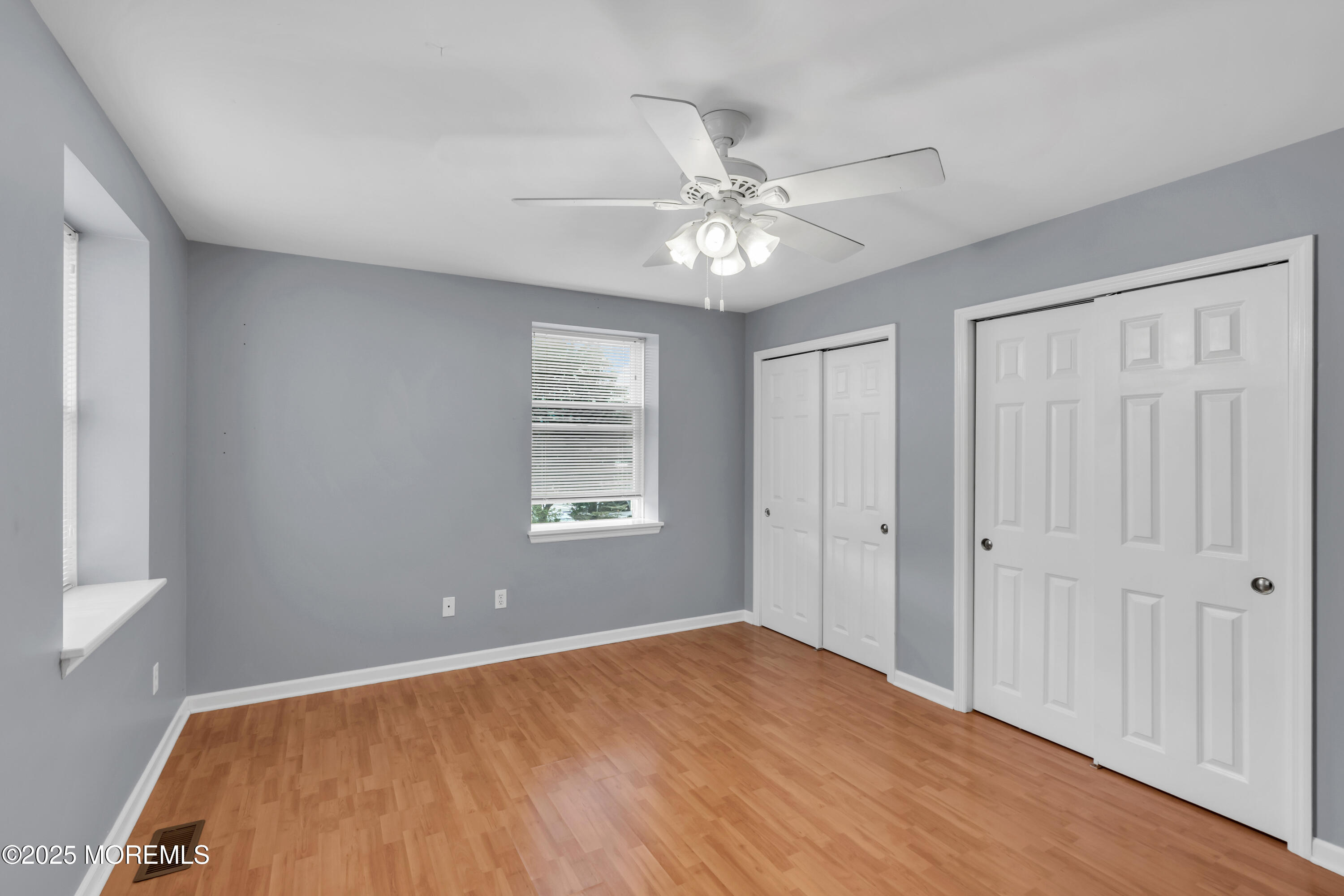 101 Main Street Farmingdale, NJ 07727 - Photo 14 of 24 wooden floor in an empty room with a window