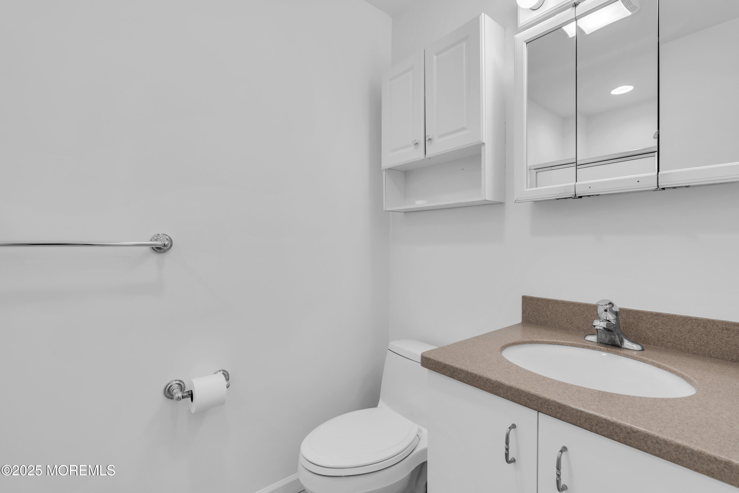 101 Main Street Farmingdale, NJ 07727 - Photo 16 of 24 a bathroom with a granite countertop bathtub sink vanity mirror and toilet