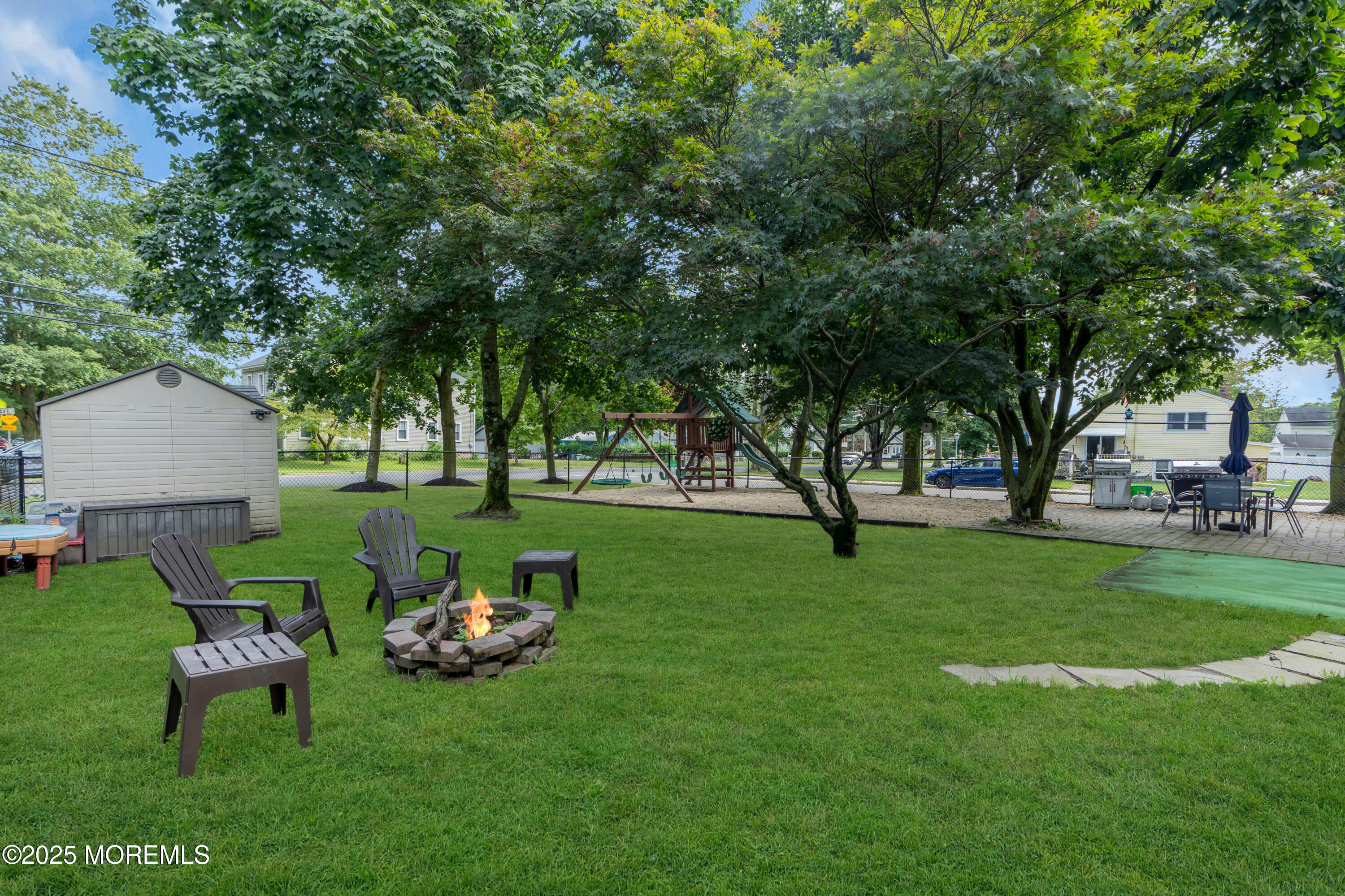 101 Main Street Farmingdale, NJ 07727 - Photo 19 of 24 a couple of white chairs sitting in a yard with large trees