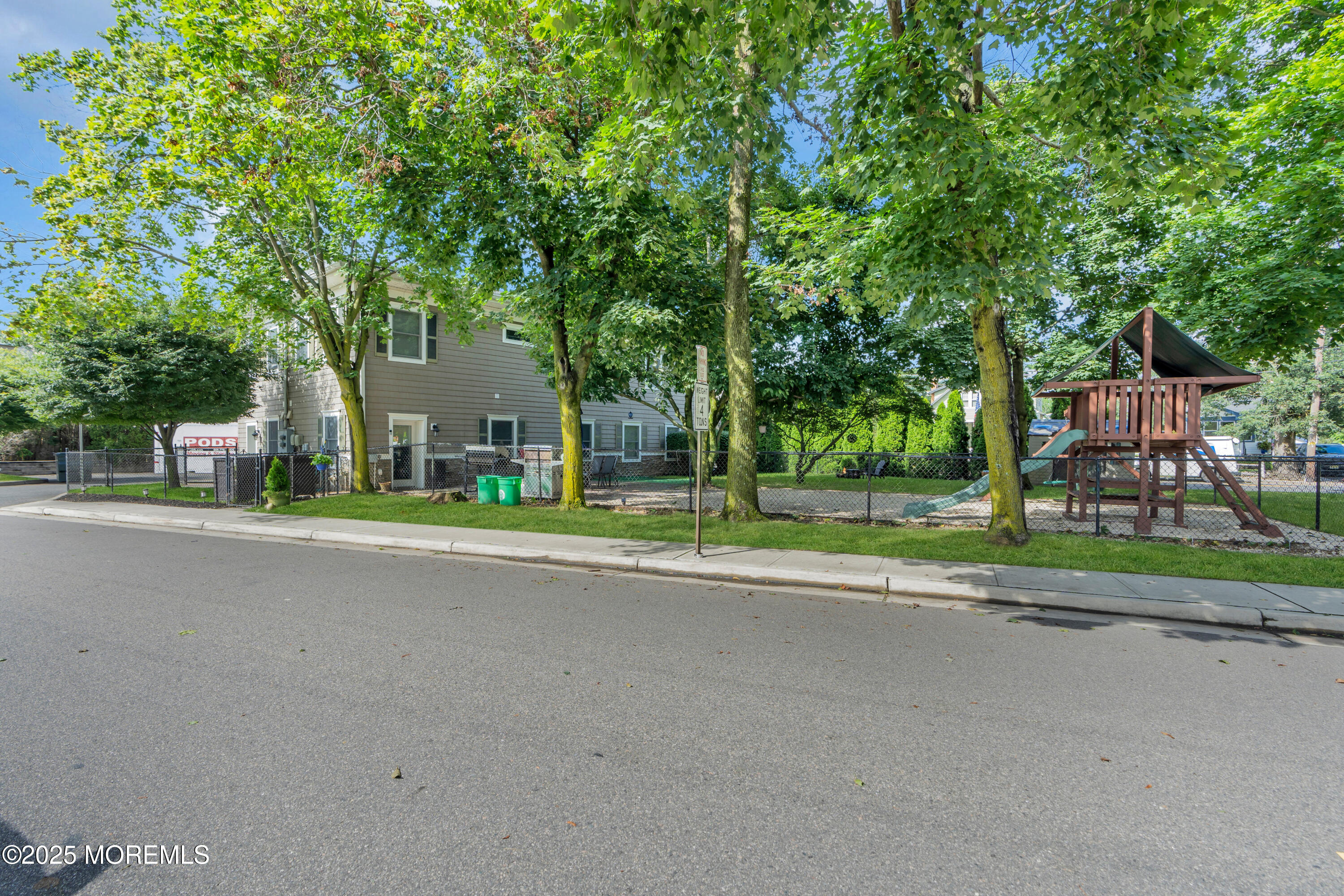 101 Main Street Farmingdale, NJ 07727 - Photo 21 of 24 a view of a house with a yard and large trees