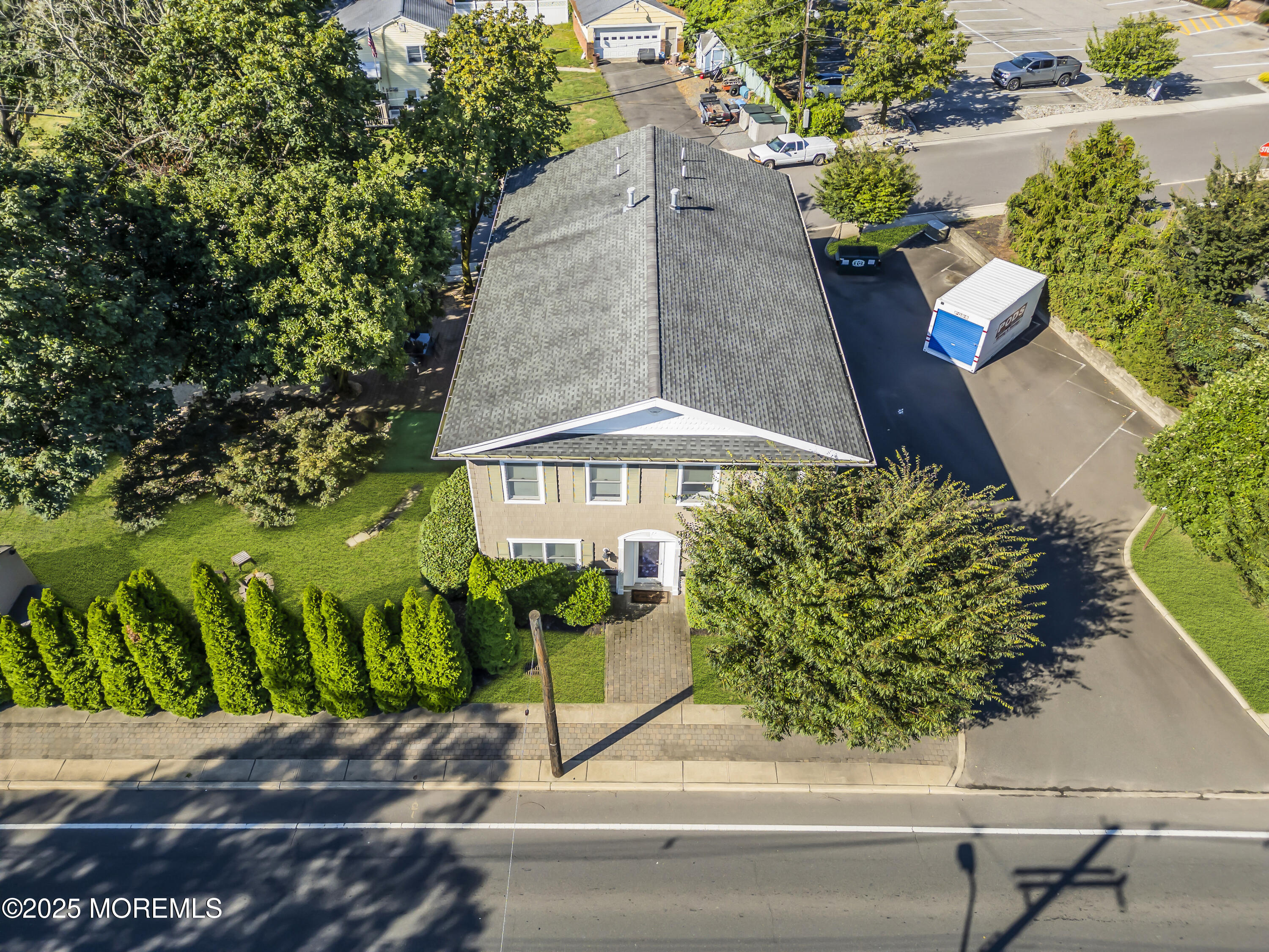 101 Main Street Farmingdale, NJ 07727 - Photo 22 of 24 a picture of a bench in front of a house