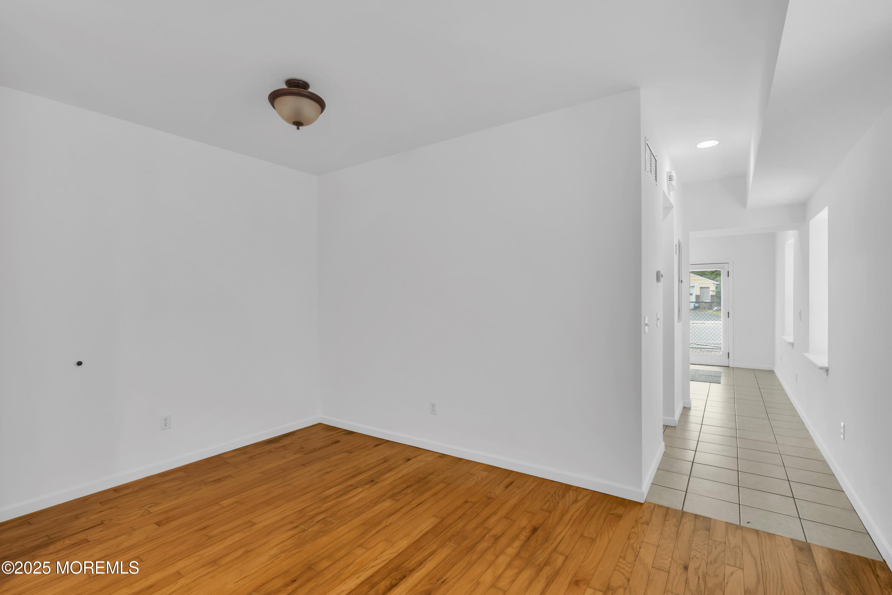 101 Main Street Farmingdale, NJ 07727 - Photo 6 of 24 a view of empty room with wooden floor