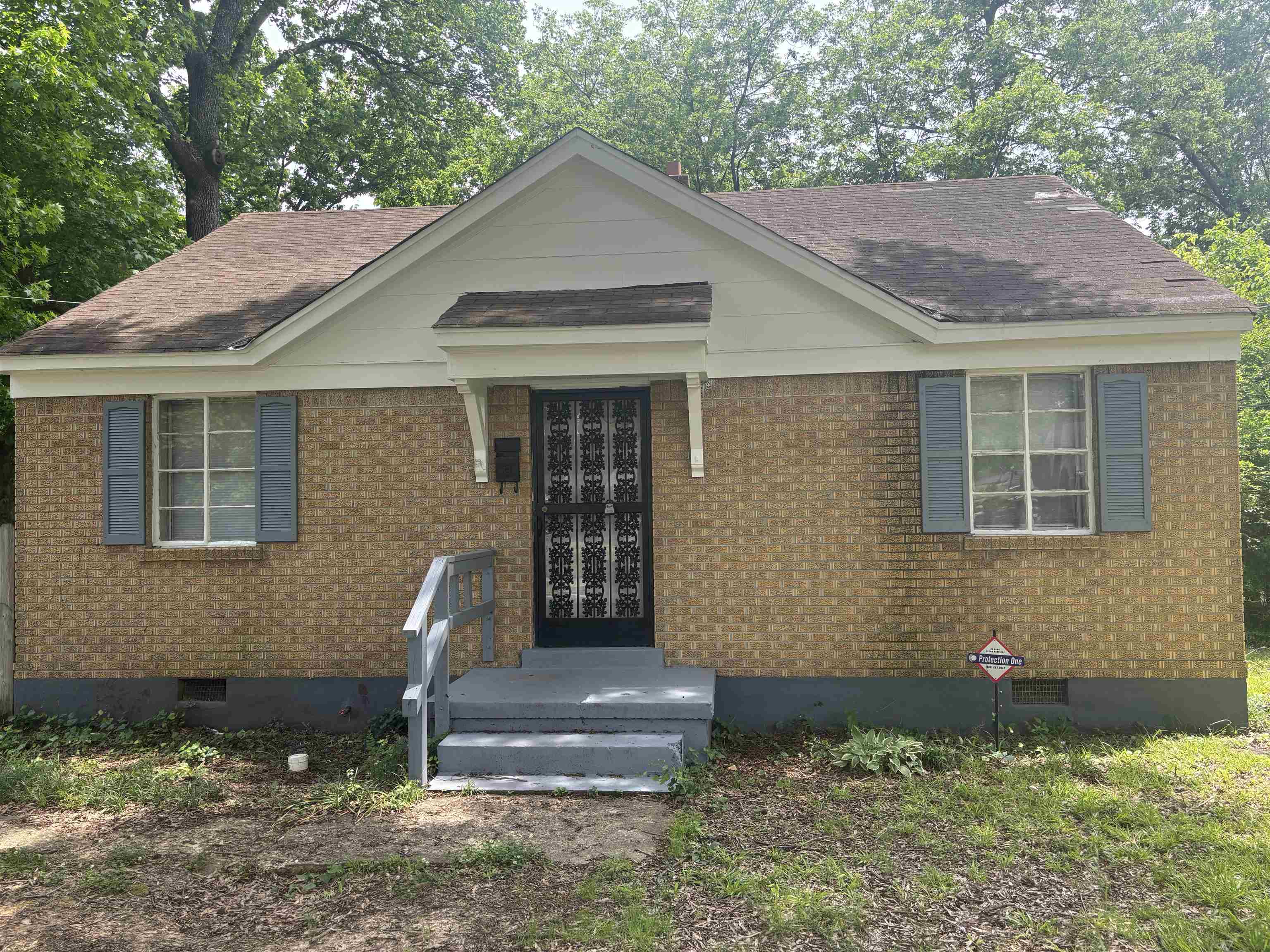 2106 Brookline Road Memphis, TN 38128 - Photo 1 of 10 View of front of property featuring a shingled roof and brick siding