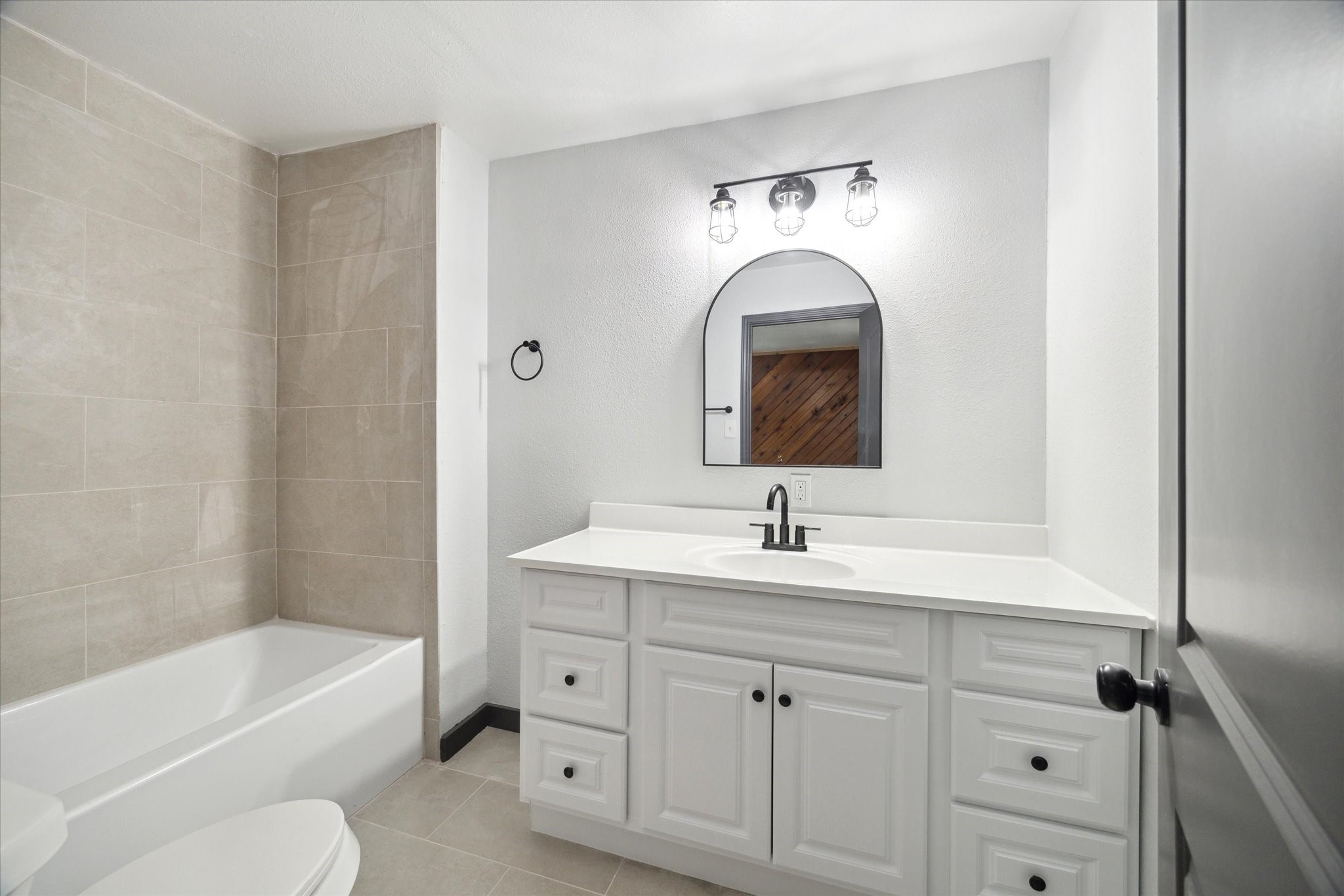 13812 Goodyear Road Dayton, TX 77535 - Photo 12 of 14 a bathroom with a sink a toilet and bathtub
