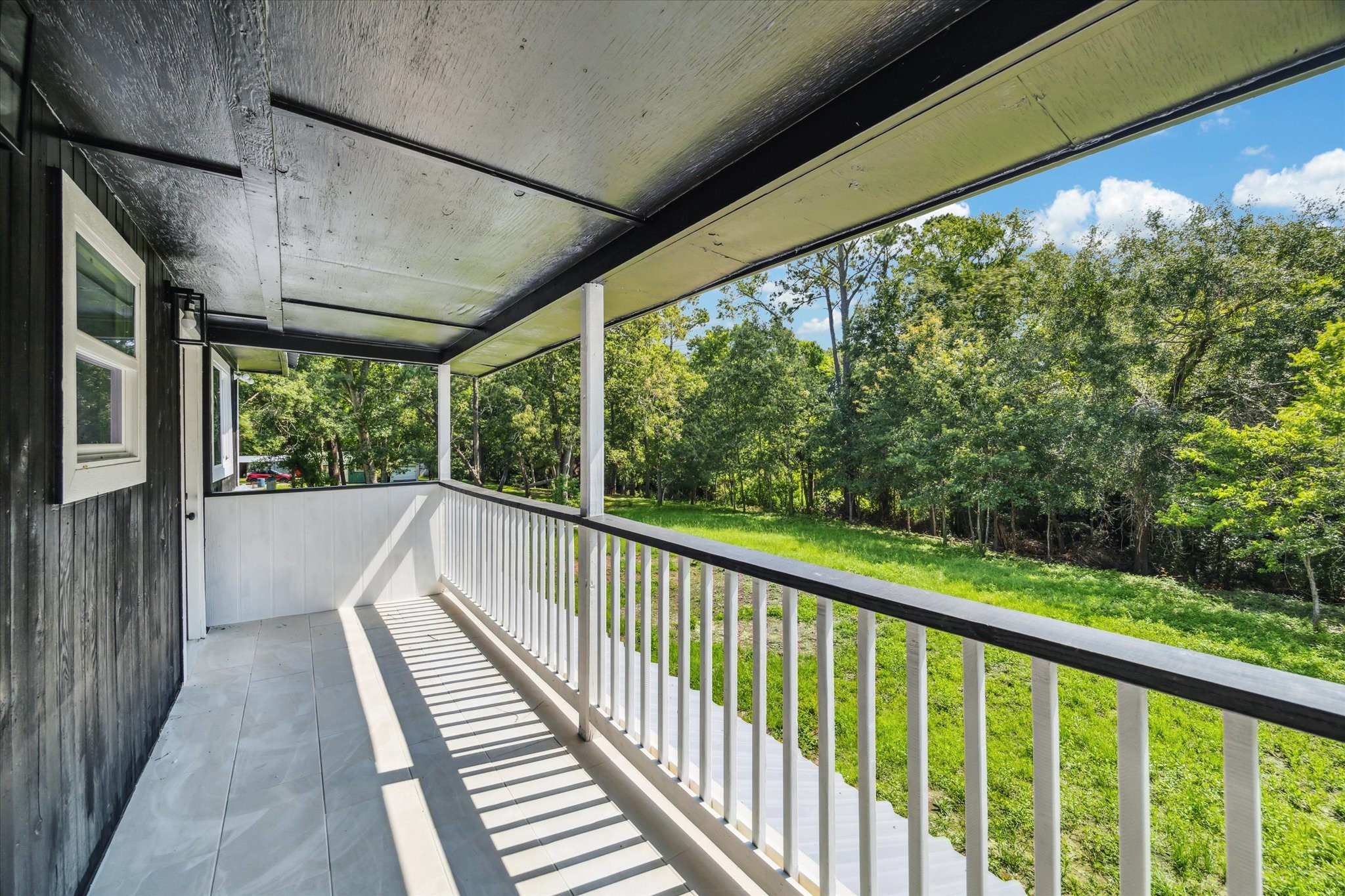13812 Goodyear Road Dayton, TX 77535 - Photo 13 of 14 a view of balcony with deck