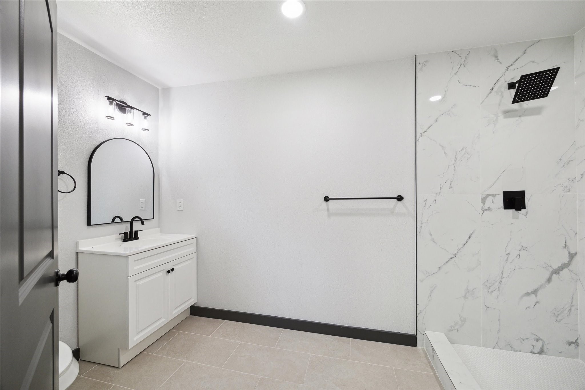 13812 Goodyear Road Dayton, TX 77535 - Photo 6 of 14 a bathroom with a sink and mirror with shower