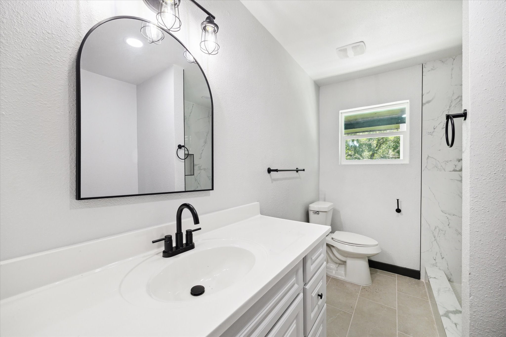 13812 Goodyear Road Dayton, TX 77535 - Photo 9 of 14 a bathroom with a sink and a mirror