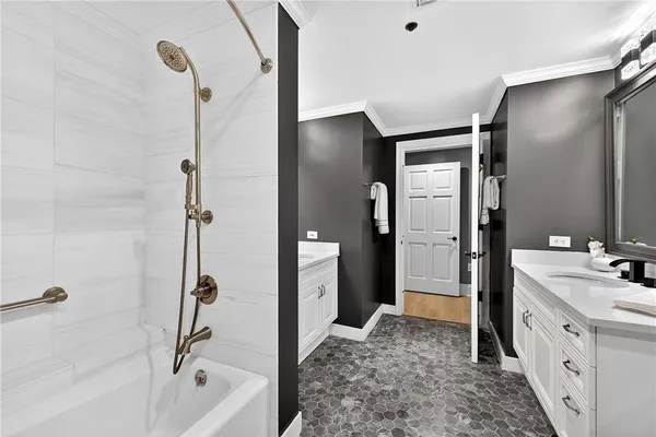 a bathroom with a tub sink and toilet