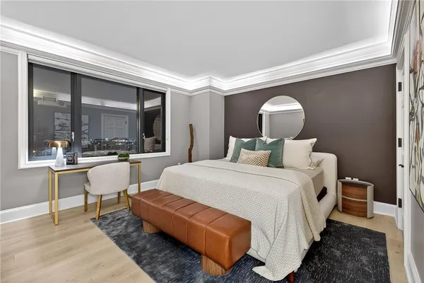 a bed room with a bed and a large window